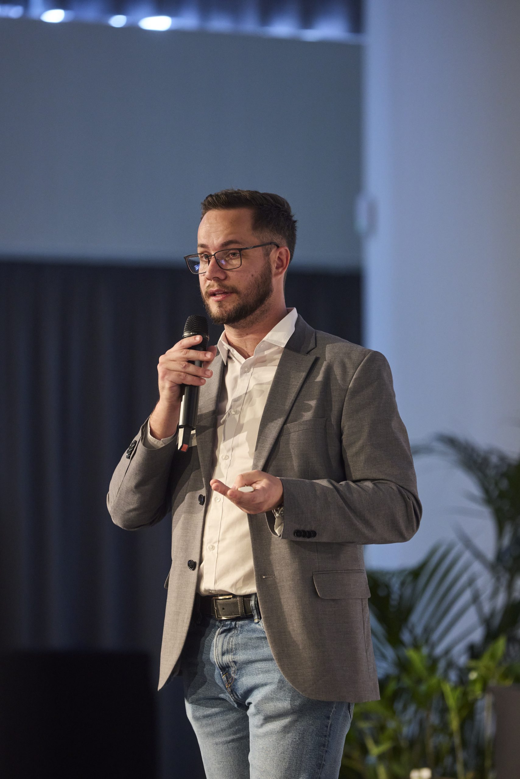 Benjamin speaking on stage